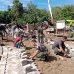 Semangat Tak Padam, Satgas TMMD HST Lanjutkan Pembangunan Jalan Usai Sholat Jumat