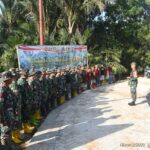 Dansatgas TMMD ke-124 Kodim 1002/HST Pimpin Apel Pagi di Titik Nol Pembangunan Jalan Haruyan